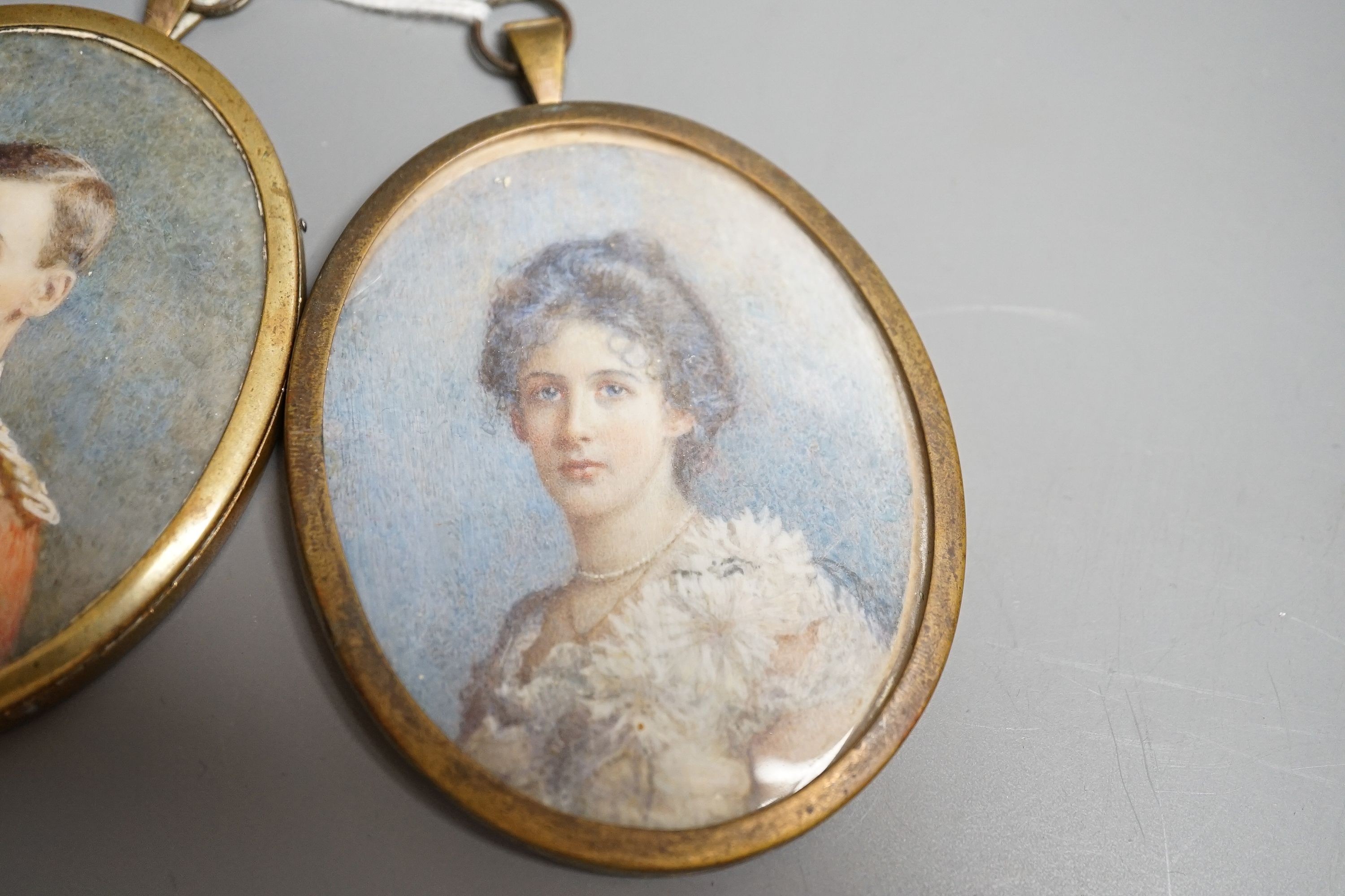 Two Edwardian portrait miniatures on ivory, one of a lady, the other an officer, height 8cm